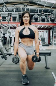 Woman doing the squats to strengthen the lower body