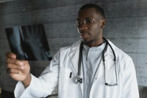 A Doctor looking at an X-ray image, emphasising the need to seek medical advice if gut problems persist