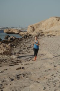 Woman jogging to support mother apron fat loss