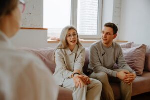 Couple seeking professional help from a couples therapist.